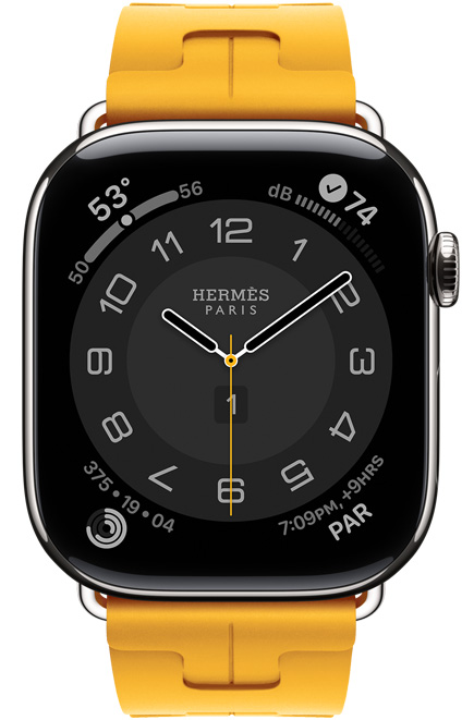 Apple Watch Hermès Series 11, Circulaire Zifferblatt (Stunden-, Minuten- und Sekundenzeiger, Hermès Paris Logo, Komplikationen: Wetter, Aktivitätsringe, Paris Zeit und UV Index), Titangehäuse, Farbe Silber, rechte Seite, Digital Crown, kombiniert mit Kilim Single Tour Armband, Farbe Jaune (Kanariengelb), Material aus Fluorelastomergummi